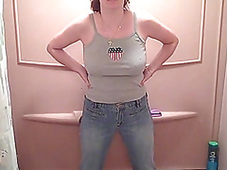 Busty MILF pissing in her pants